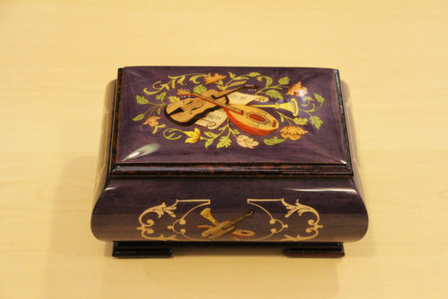 Italian inlaid music box adorned with musical instruments